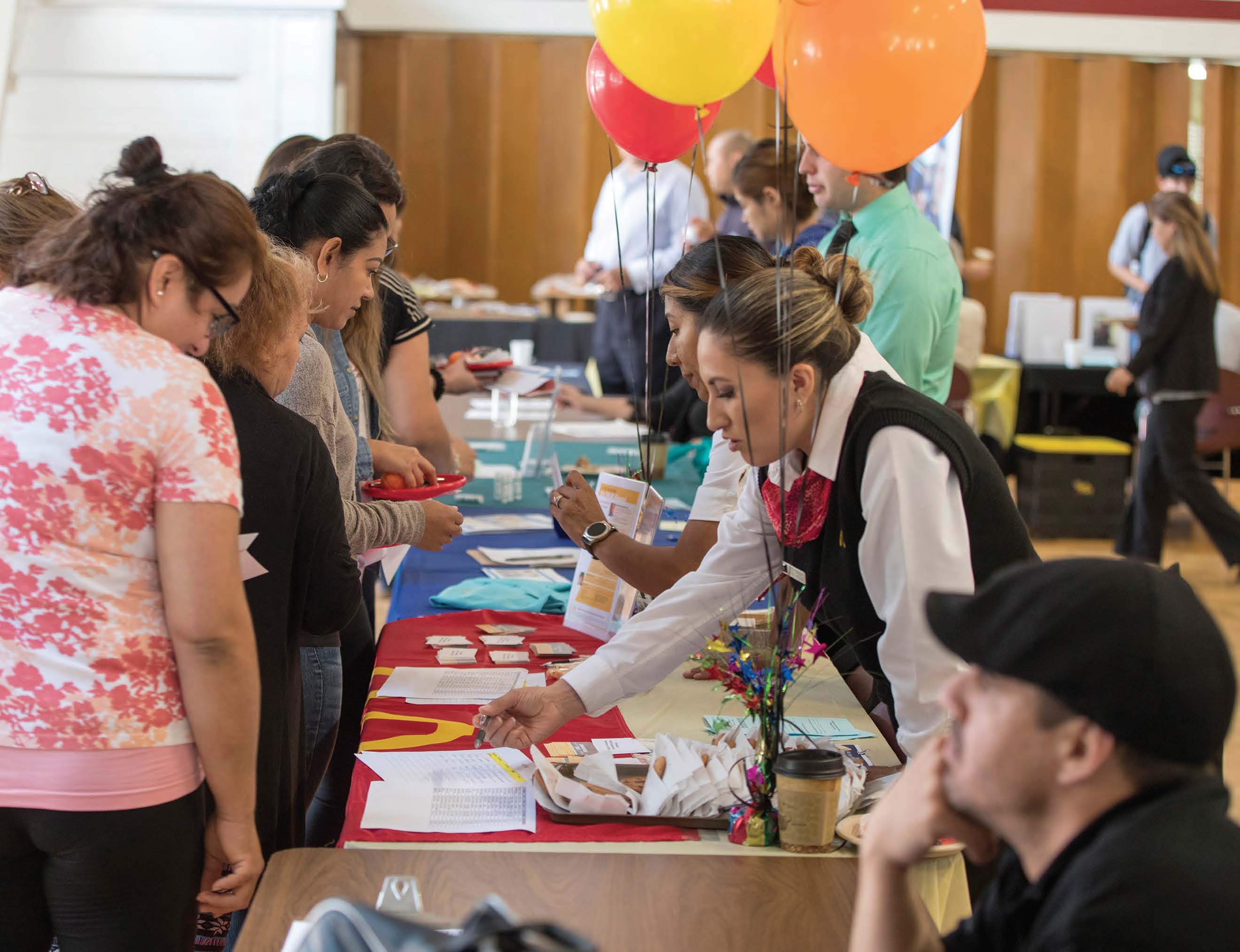 career fair info table with balloons